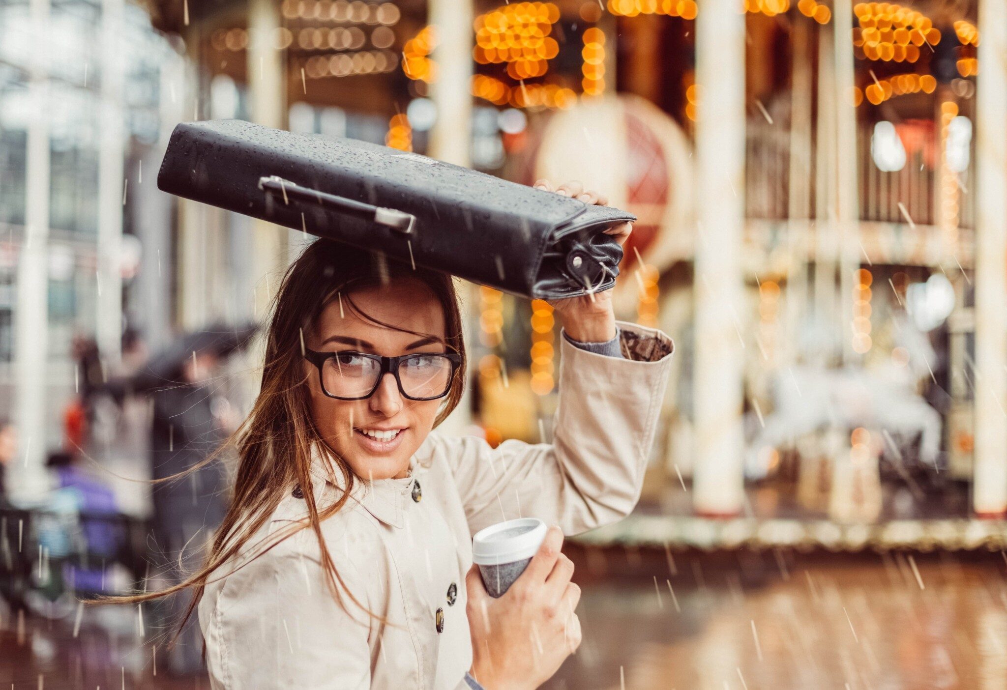 Young woman going to work on a rainy day