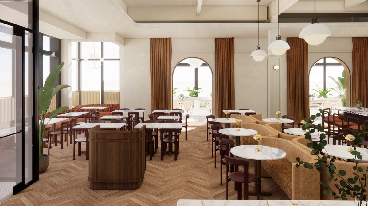A bright, modern restaurant interior with large windows, white marble tables, brown chairs, booth seating, and pendant lights. Green plants adorn the space, creating a welcoming atmosphere.